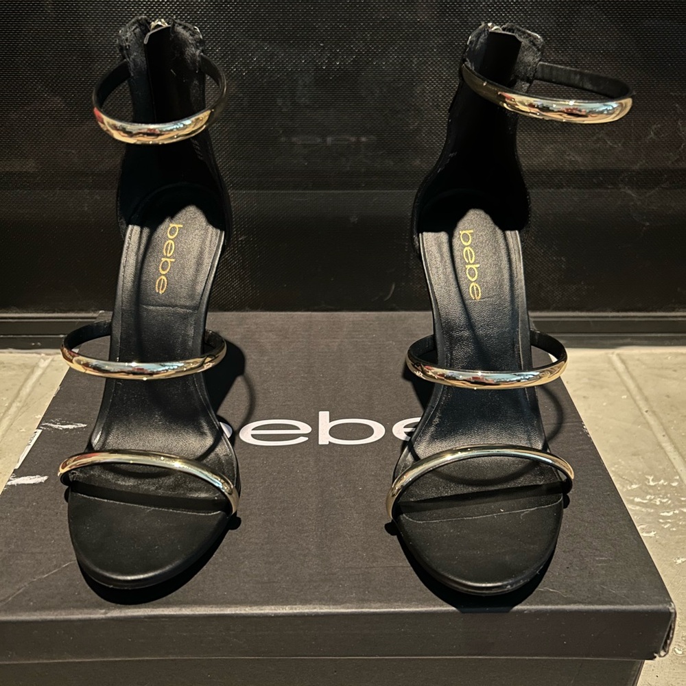 Bebe Women's Heels in Black with Gold Accents